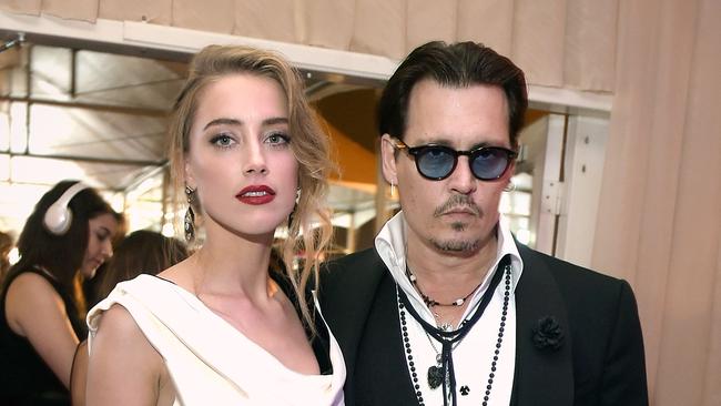 Actors Amber Heard and Johnny Depp on the red carpet. Photo: Jason Kempin/Getty Images