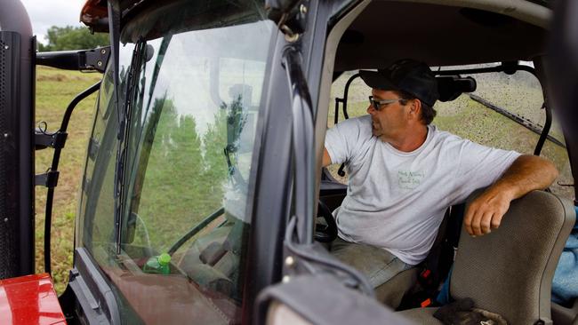 Earl Bikel, bails hay on his farm near West Branch, Iowa. Picture: Scott Morgan