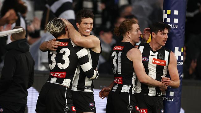 Collingwood players celebrate a goal from Beau McCreery Photo by Michael Klein.