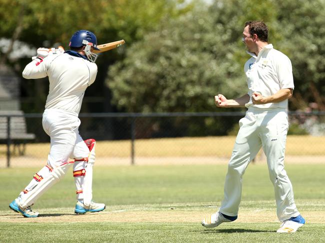 Oakleigh’s Michael Splatt celebrates the wicket of Malvern’s Robert Templeton. Picture: Hamish Blair