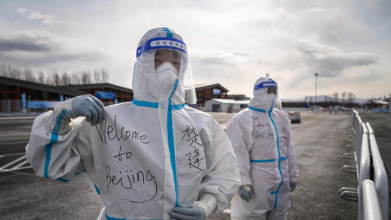 A man in a hazmat suit in Yanqing that host the alpine skiing and sliding venues ahead of the 2022 Beijing Winter Olympics. Picture: AFP