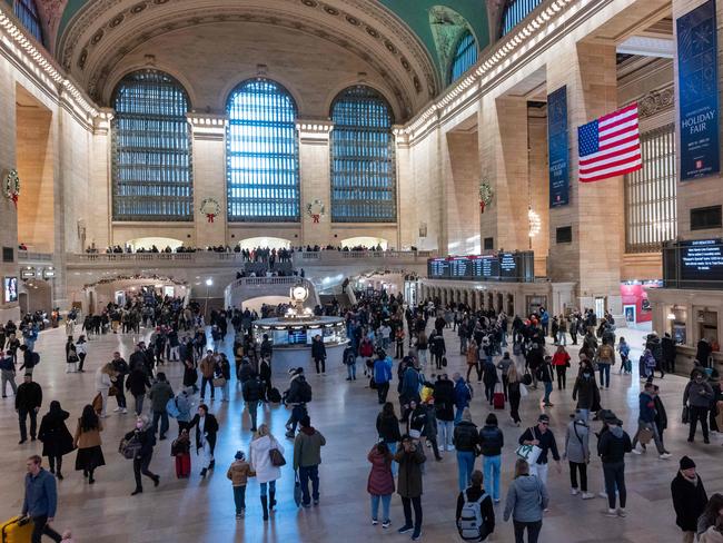 NEW YORK, NEW YORK - DECEMBER 22: People walk through Grand Central Terminal in midtown Manhattan only days before the Christmas holiday on December 22, 2023 in New York City. New York City has witnessed an influx of tourists and others coming to the city this holiday season to shop, eat and take in a show. The Port Authority of New York and New Jersey is expecting roughly 14 million travelers to pass through its airports, bridges and tunnels between Thursday, Dec. 21, and Jan. 2.   Spencer Platt/Getty Images/AFP (Photo by SPENCER PLATT / GETTY IMAGES NORTH AMERICA / Getty Images via AFP)