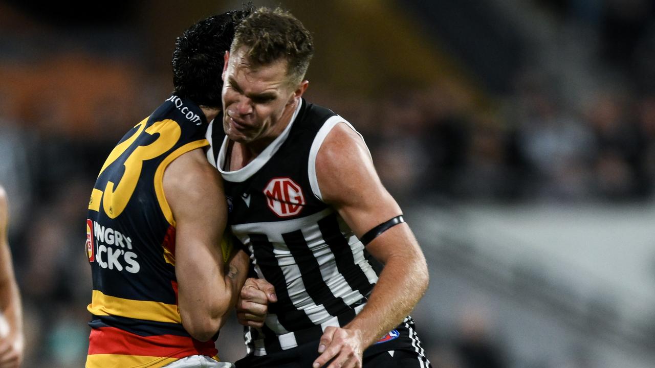 Izak Rankine of the Crows is knocked out by a late hit from Dan Houston. (Photo by Mark Brake/Getty Images)