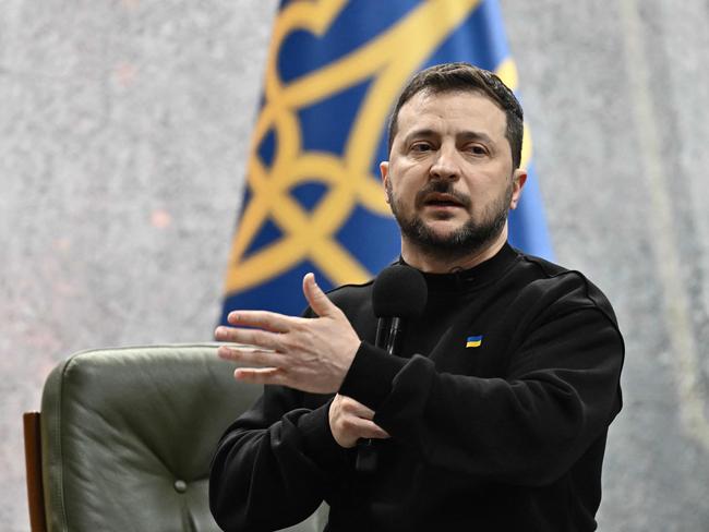 Ukrainian President Volodymyr Zelensky gestures as he gives a press conference in Kyiv on February 24, 2023, on the first anniversary of the Russian invasion of Ukraine. (Photo by Genya SAVILOV / AFP)