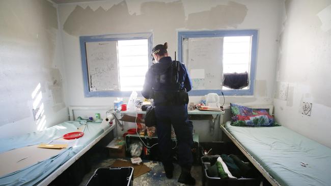 Corrective Services officers raid cells at Silverwater Jail looking for contraband. Picture: Richard Dobson