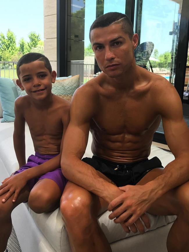 Cristiano Ronaldo and his mini-me son - complete with matching hairstyles and abs. Picture: Cristiano Ronaldo / Instagram