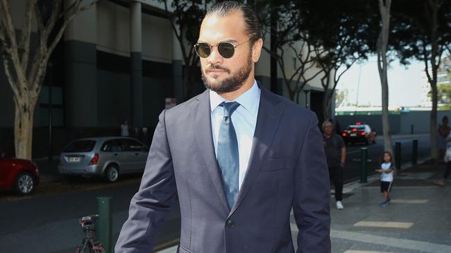 Karmichael Hunt leaves court after having his cocaine charged dropped.