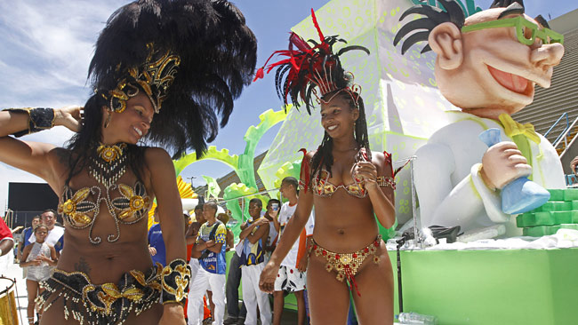 Dancers from the Union da Ilha samba school perform at the Sambadrome stadium / AFP