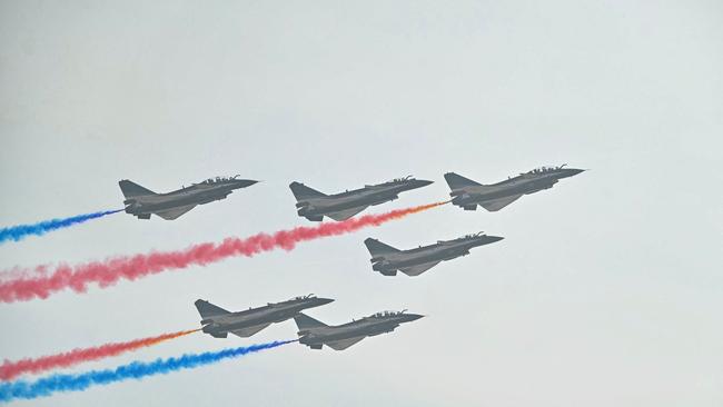 Chinese-made Chengdu J-10 Vigorous Dragon fighter jets fly in formation during the 15th China International Aviation and Aerospace Exhibition in Zhuhai, in south China's Guangdong province on November 12, 2024. (Photo by Hector Retamal / AFP)