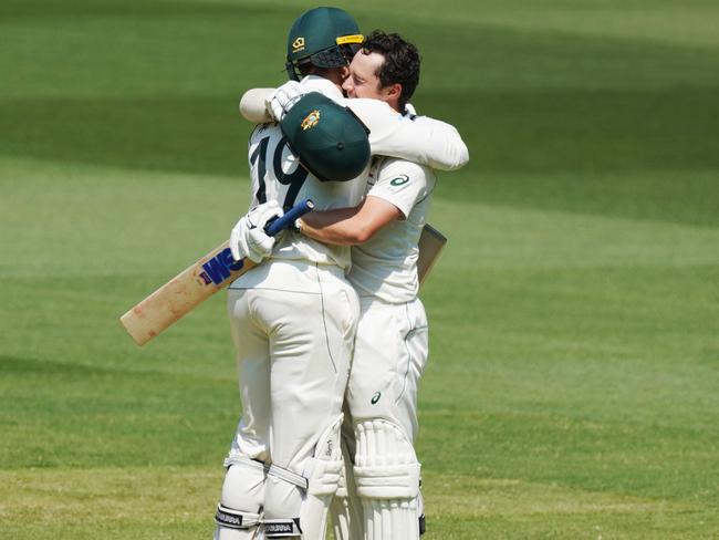 Head celebrates his century with teammate James Pattinson. Picture: AAP