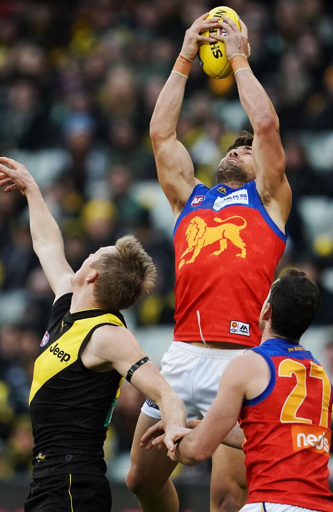 Marcus Adams flies high to mark in a contest against Jack Riewoldt. Picture: AAP Image/Michael Dodge.