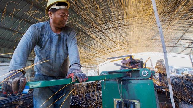 Steel bars being cut in Jiangsu province. Picture: Reuters