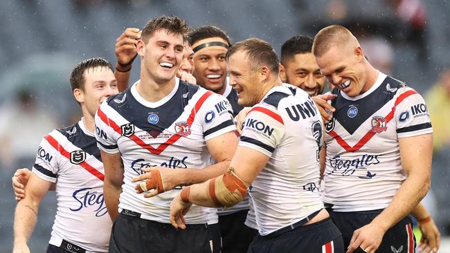 Fletcher Baker of the Roosters celebrates with his team mates after scoring a try (Photo by Mark Kolbe/Getty Images)