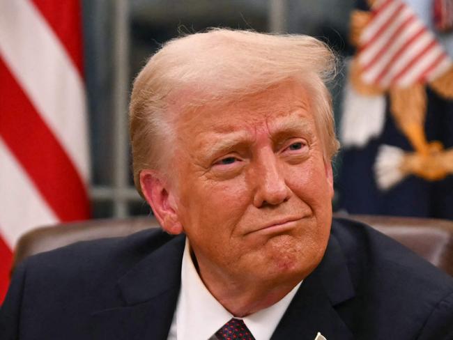 US President Donald Trump signs executive orders in the Oval Office of the White House in Washington, DC, on January 20, 2025. Picture: NewsWire / Jim WATSON / POOL / AFP