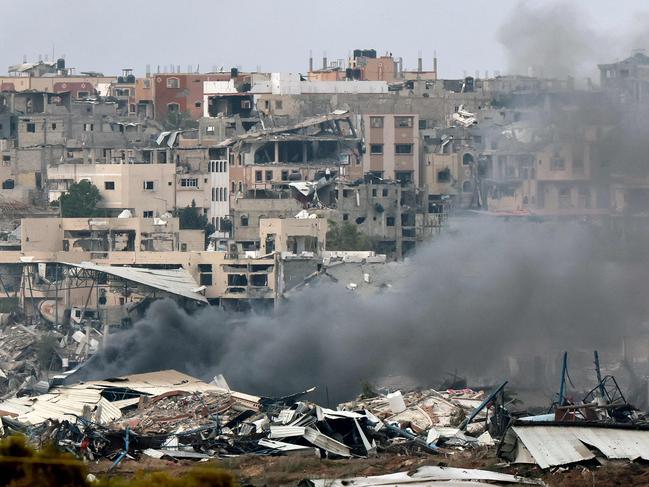 <font><font>Smoke billowing amid the destruction in northern Gaza resulting from weeks of Israeli bombardment. Picture: AFP</font></font>