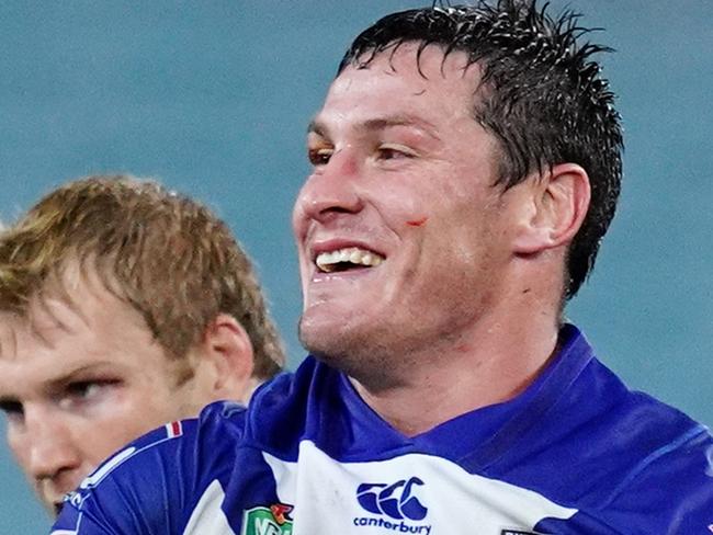 SYDNEY, AUSTRALIA - AUGUST 02:  Kerrod Holland of the Bulldogs and Josh Jackson of the Bulldogs celebrate winning the round 21 NRL match between the Canterbury Bulldogs and the Brisbane Broncos at ANZ Stadium on August 2, 2018 in Sydney, Australia.  (Photo by Cameron Spencer/Getty Images)