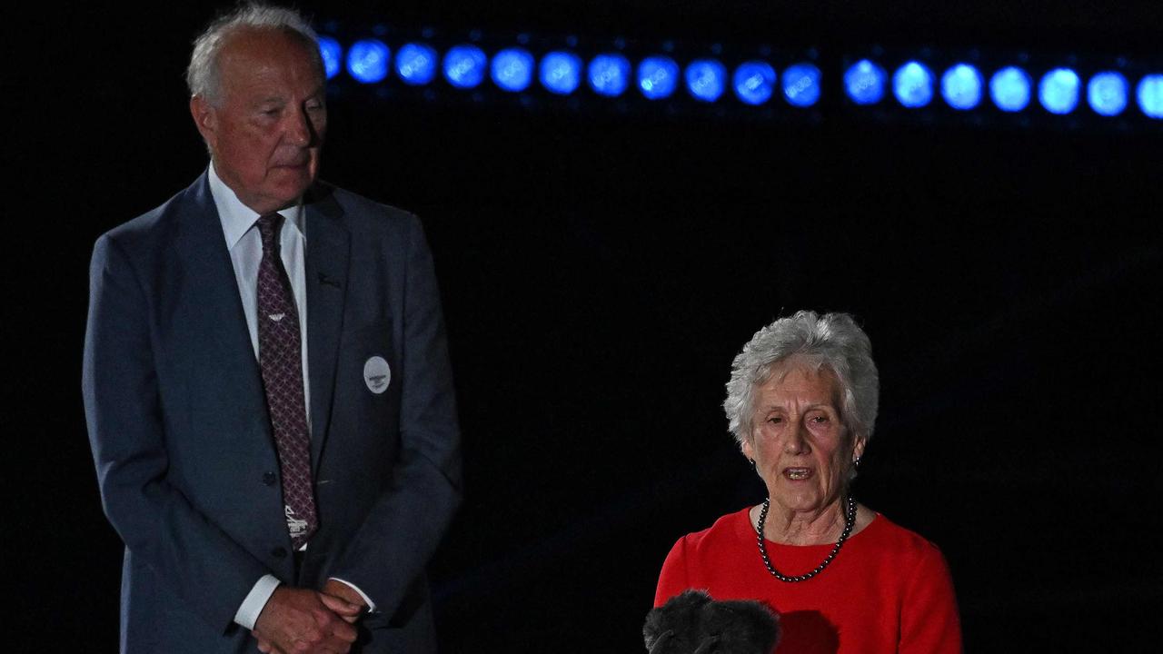 President of the Commonwealth Games Federation (CGF) Louise Martin delivers a speech (R) next to Chair of Birmingham 2022 Organising Committe Board John Crabtree.