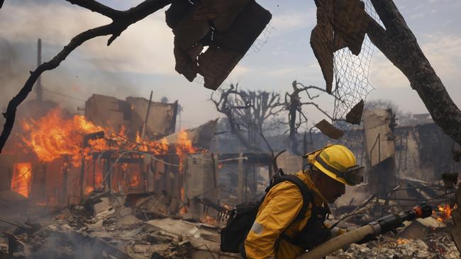 A firefighter battles the Palisades fire. Picture: AP