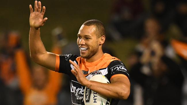 Moses Mbye celebrates a try for Wests Tigers against the Sea Eagles. Picture: AAP