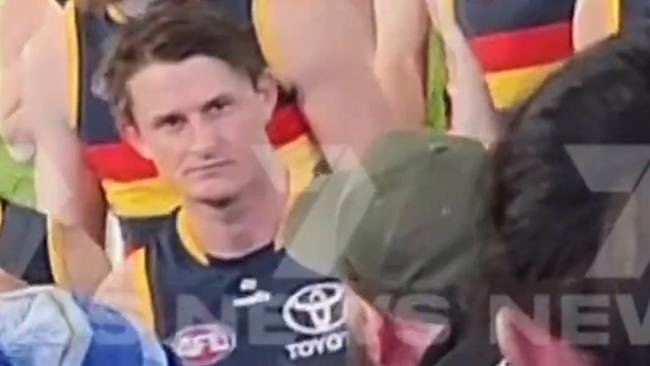 The video showing the alleged incident of Matt Crouch knocking off a football fans hat after the Showdown  .  Picture: 7NEWS