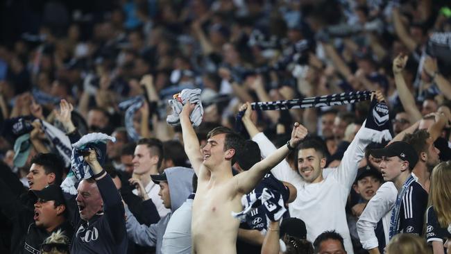 Melbourne fans celebrate a goal by Beshart Berisha. Picture: Brett Costello