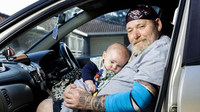 Craig Soden with four-month-old George is living out of his car in a Brisbane park. Picture: Richard Walker