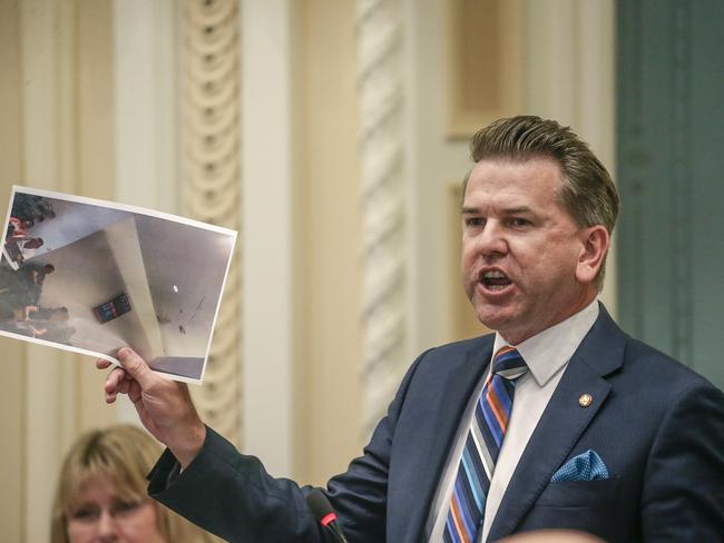 Queensland Deputy Premier Jarrof Bleijie tables a picture of Opposition Leader Steven Miles as he speaks during Question time at Queensland Parliament. Picture: NewsWire / Glenn Campbell