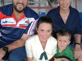 FOOTY GAME: Warwick Cowboys coach Matt Grew with Natalie, Lily (front) and William Nolan and the Basil Nolan Memorial Shield, which will be contested for the first time on Saturday. Picture: Gerard Walsh