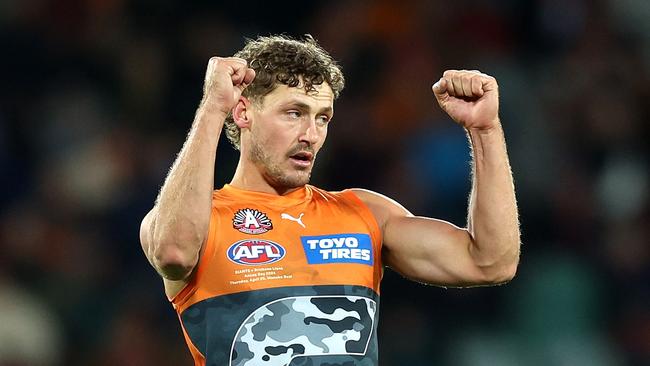 CANBERRA, AUSTRALIA - APRIL 25: Harry Perryman of the Giants celebrates kicking a goal during the round seven AFL match between Greater Western Sydney Giants and Brisbane Lions at Manuka Oval, on April 25, 2024, in Canberra, Australia. (Photo by Mark Metcalfe/AFL Photos/via Getty Images )