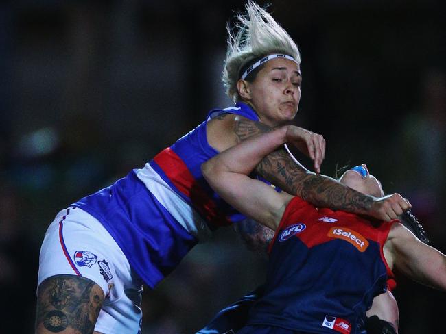 MELBOURNE, AUSTRALIA - SEPTEMBER 03: Moana Hope of the Bulldogs collects a Demons player high during the AFL Women's Exhibition Match between the Western Bulldogs and the Melbourne Demons at Whitten Oval on September 3, 2016 in Melbourne, Australia. (Photo by Michael Dodge/Getty Images)