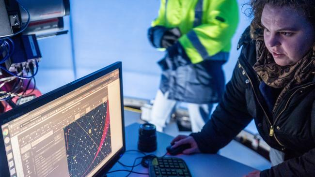 Macquarie University PhD candidate Sarah Caddy works on the Huntsman Telescope in Siding Spring Observatory, NSW.