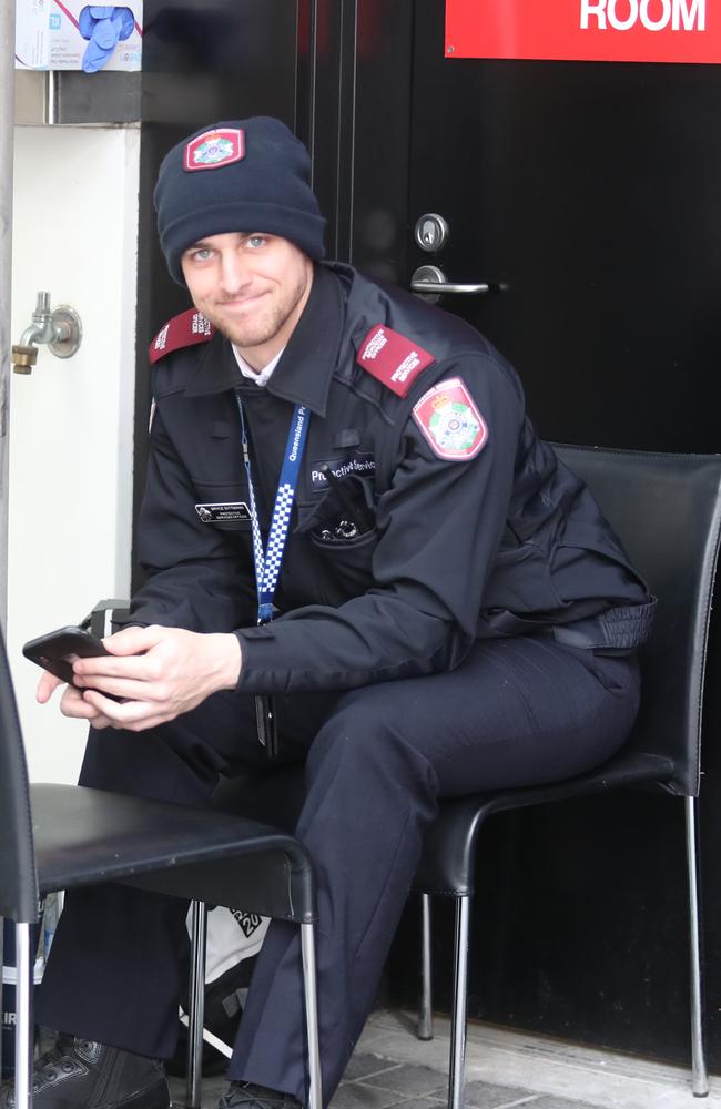 A protective services officer guards a quarantine hotel. Picture: Annette Dew