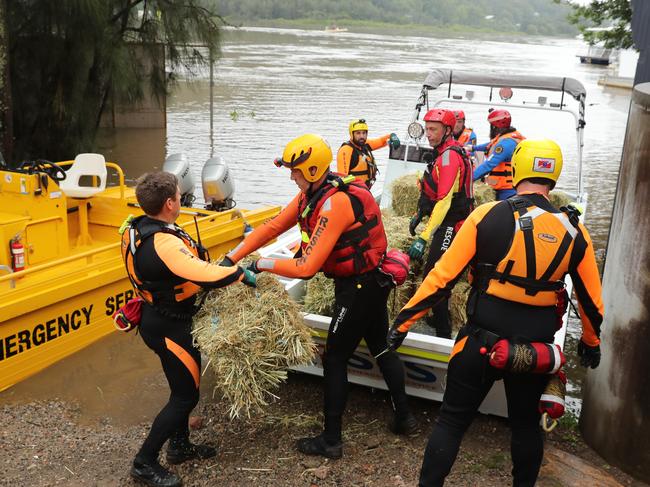 The SES loads a boat with supplies for residents cut off by floodwaters near Wisemans Ferry. Picture: Tim Hunter