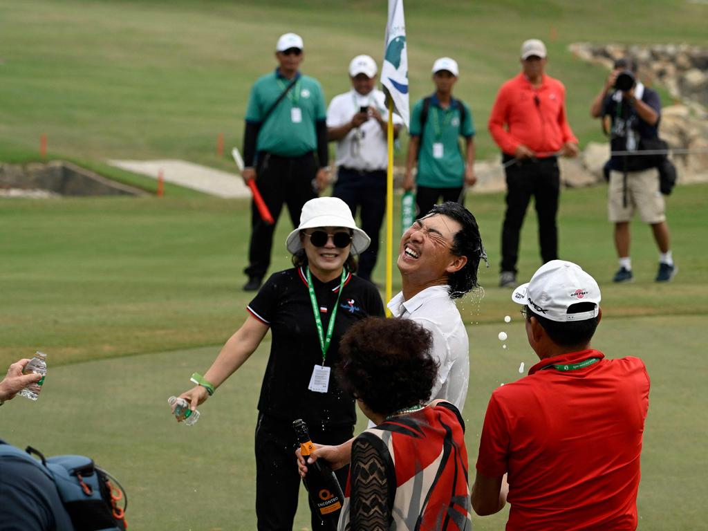 Min Woo Lee (centre) celebrates after winning the Macau Open. Picture: Paul LAKATOS / Asian Tour / AFP