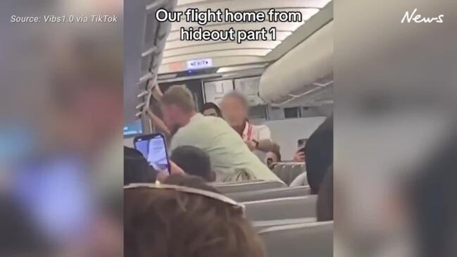 Shock moment man tries to open plane door