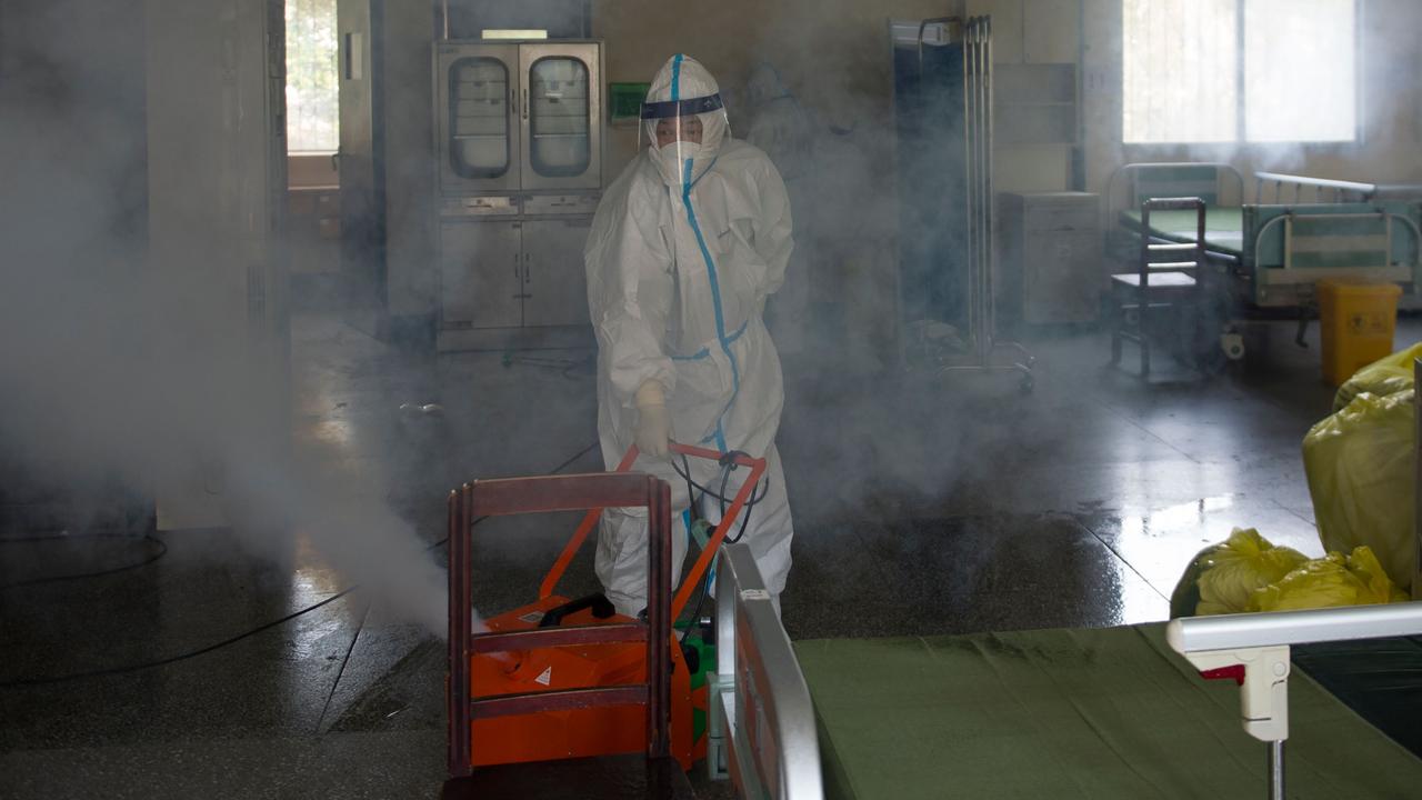 A worker disinfects a room in the Wuhan hospital in Wuhan, in China. Picture: STR/AFP