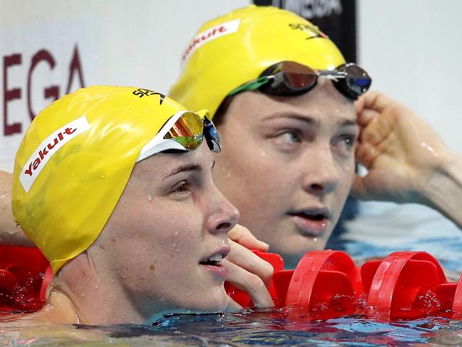 FILE - In this Aug. 8, 2015, file photo, Australia's Bronte Campbell, left, and her sister Cate Campbell, right, look at results after a women's 50-meter freestyle heat at the Swimming World Championships in Kazan, Russia. The two are both leading medal contenders heading into the Rio Olympics, though they quickly point out this isn't one of those sibling rivalries from the Serena vs. Venus Williams mold, the kind that stirs mixed emotions when they inevitably face each other for the same prize. "It's very different (than) Venus and Serena because we're not playing against each other on the tennis court," Bronte Campbell said Tuesday, Aug. 2. "We're swimming in a swimming pool against six other people in the race. I'm not really racing against Cate. I'm racing against myself and trying to do my best race." (AP Photo/Michael Sohn, File)