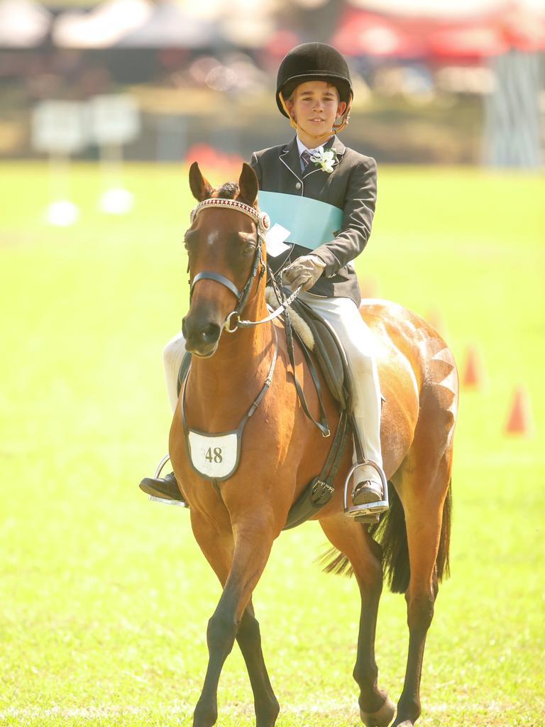 Rudi Walker-Sangster on Tapu Daquiri wins the Anita Flockhart Memorial Award for U/13s at The Royal Darwin Show. Picture GLENN CAMPBELL