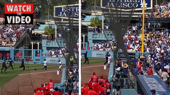 Los Angeles Dodgers ball girl takes down fan who ran on the field