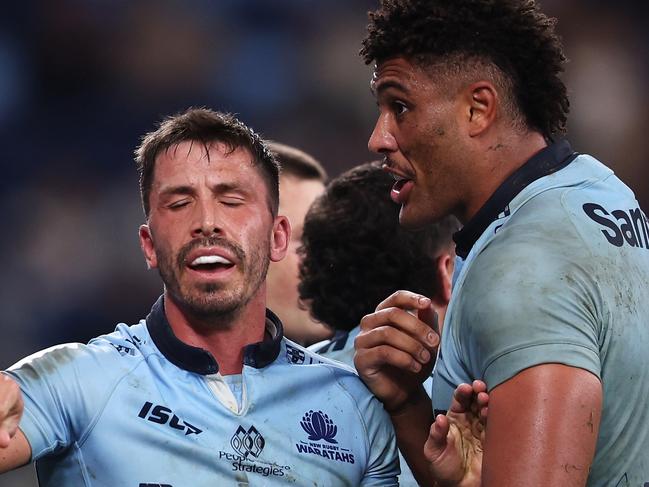 SYDNEY, AUSTRALIA - MAY 16: Jake Gordon (C) of the Waratahs steps in as Antonio Shalfoon of the Crusaders and Miles Amatosero of the Waratahs exchange heated words during the round fourteen Super Rugby Pacific match between Waratahs and Crusaders at Allianz Stadium, on May 16, 2025, in Sydney, Australia. (Photo by Mark Kolbe Photography/Getty Images)