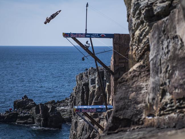 Andy Jones of the USA diving from the 28 metre platform during the first competition day of the eighth stop of the Red Bull Cliff Diving World Series at Shirahama, Japan. Picture: AFP PHOTO / RED BULL / Jason HALYAKO