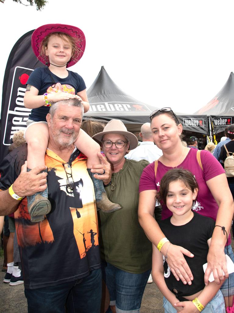 Jasmine Cumming gets a lift from Larry Hoffmann, with Karen Hoffman and Karen and Lily Cumming. Meatstock Festival, Toowoomba showgrounds. April 2022