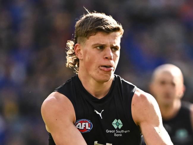 PERTH, AUSTRALIA - AUG 18: Cooper Lord of the Blues kicks the ball during the 2024 AFL Round 23 match between the West Coast Eagles and the Carlton Blues at Optus Stadium on August 18, 2024 in Perth, Australia. (Photo by Daniel Carson/AFL Photos via Getty Images)