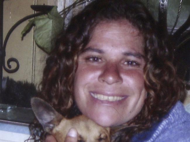 This 2010 photo released by the Daley family shows Lynette Daley cuddling her dog, Bunyip.