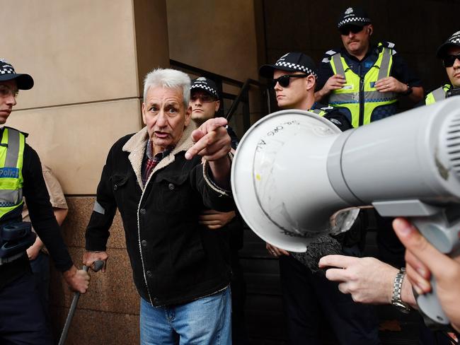 A man, believed to be a UPF supporter yells, at anti-racism protesters. Picture: Jake Nowakowski