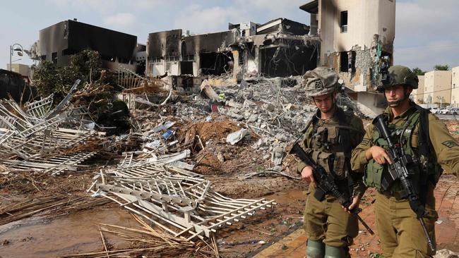 Soldiers outside an Israeli police station that was damaged during battles to dislodge Hamas militants. Picture: AFP