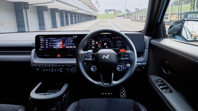 The Ioniq 5 N steering wheel has shift paddles and shortcuts for driving modes.
