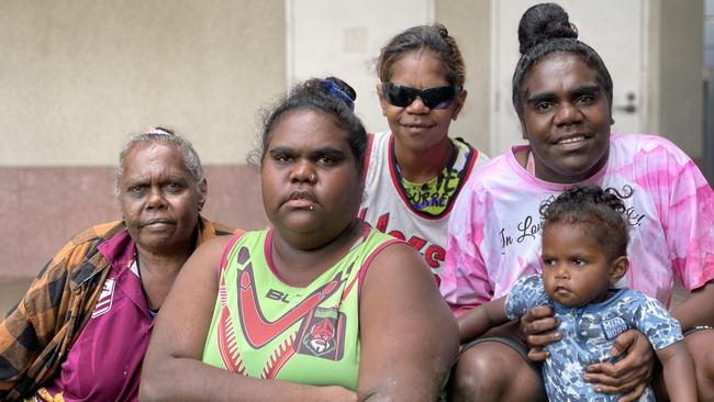 Doomadgee women Olive Roberts, Evelyn Ned, and Paula and Denise Booth, whose sister Betty died as a consequence of rheumatic heart disease and is one of three women whose deaths are subject to a coronial inquest, pictured with youngster Joel Ned-Anderson outside Cairns courthouse. Picture: Bronwyn Farr.