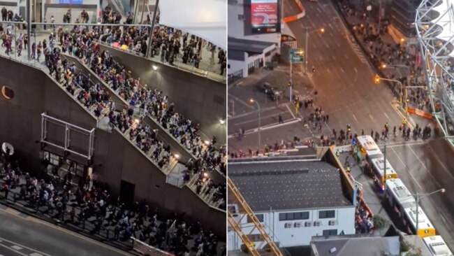 Dozens of fans are seen packed together exiting the Gabba on Sunday.