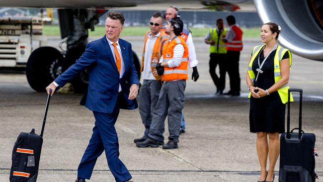 Netherland's football team head coach Louis van Gaal arrives at Rotterdam-The Hague airport in Rotterdam, on July 13, 2014. Brazil's miserable World Cup campaign ended in a chorus of boos on July 12, 2014 as the hosts slumped to a 3-0 defeat against the Netherlands in the third place playoff match. AFP PHOTO / ANP / SANDER KONING ***Netherlands Out***